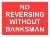 NO REVERSING WITHOUT BANKSMAN